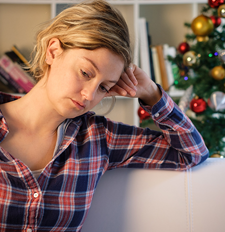 Sad christmas days for lonely woman at home